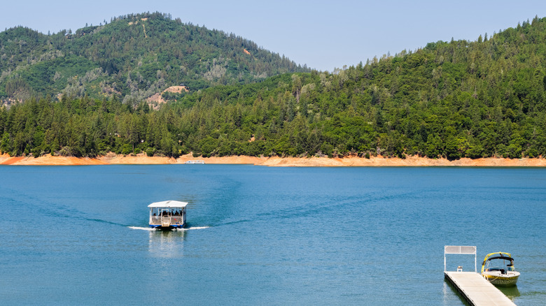 A boat on the water on the McCloud Arm of Shasta Lake in California