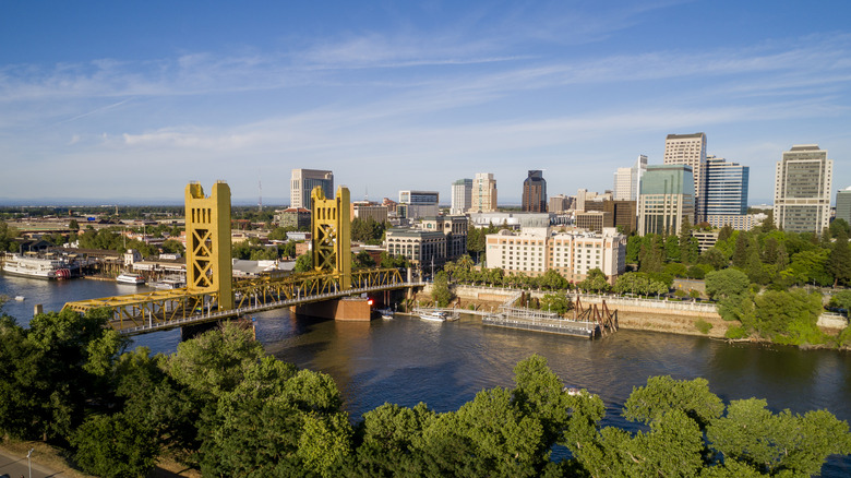 Sacramento's yellow Tower Bridge over the Sacramento River in front of downtown