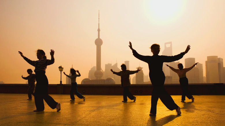 People practicing tai chi on the Bund