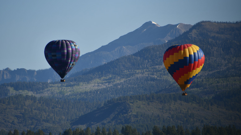 Hot air balloons floating over Pagosa Springs during its annual balloon festival