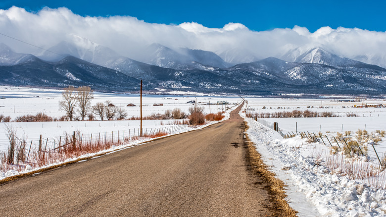 A rural road in Westcliffe, Colorado, with views of the Sangre de Cristo Montains