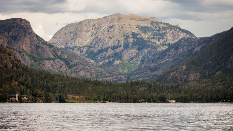 waters of grand lake in foreground, mountain in background