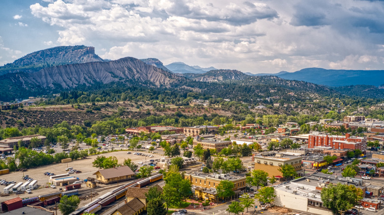 Panoramic view of downtown Durango on summer day with mountains in background.
