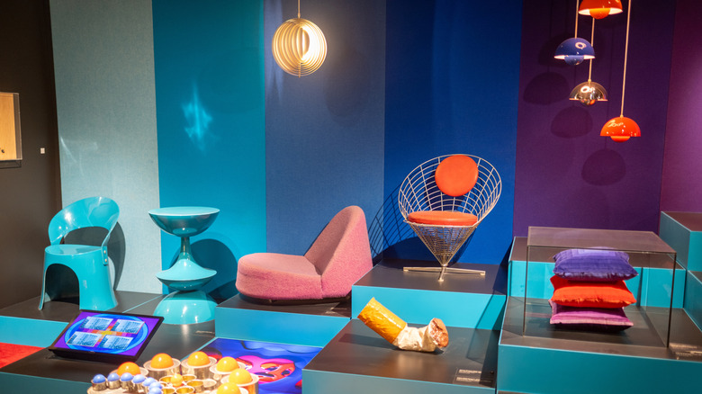 Colorful display of Danish-designed chairs, lamps, and art in the Danish Design Museum, Copenhagen
