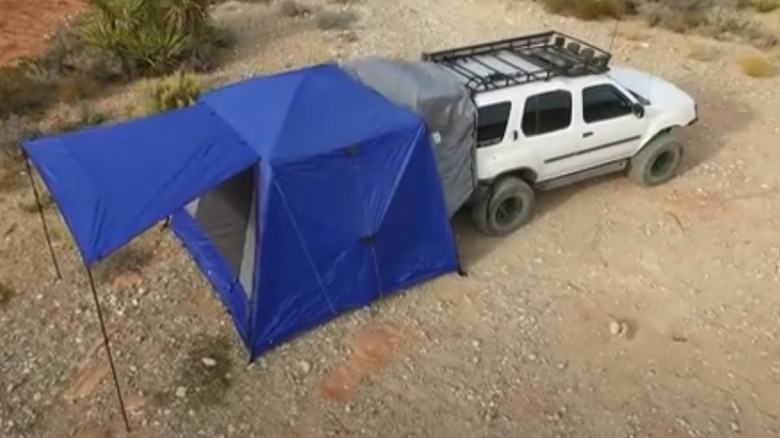 SUV tent set up on back on vehicle