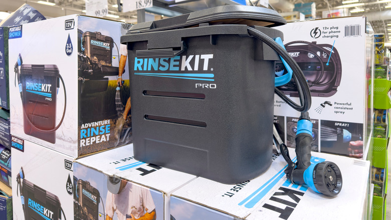 A retail display of the RinseKit portable shower.