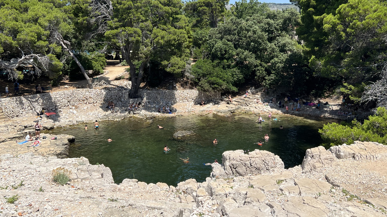 People swimming in Mrtvo More on Lokrum Island