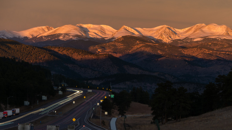 A view of the Continental Divide and I-70 at Genesee Park at sunset.