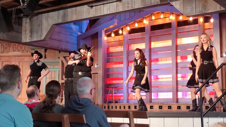 The "Forever Country" show at Dollywood, with performers on a wooden stage