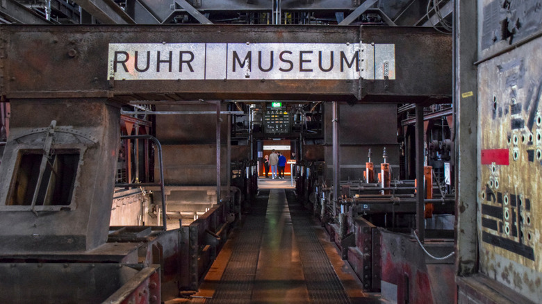 Ruhr Museum entrance sign on a steel beam inside of Zollverein's former coal-washing plant