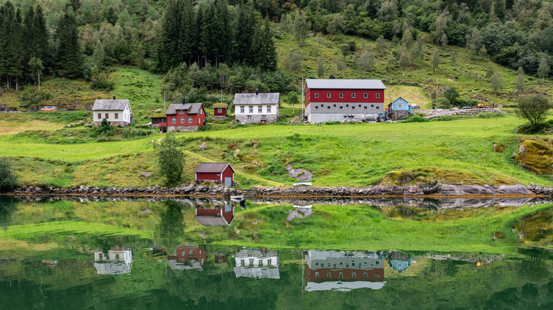 Fjaerland buildings reflecting onto Fjaerland Fjord
