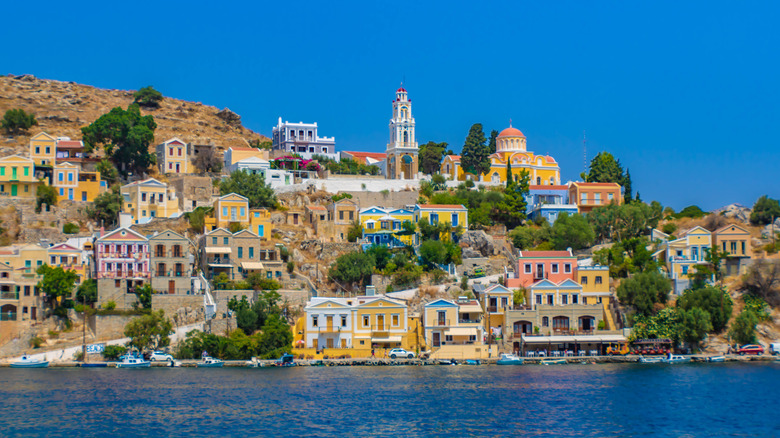 Colorful buildings of Symi overlooking water