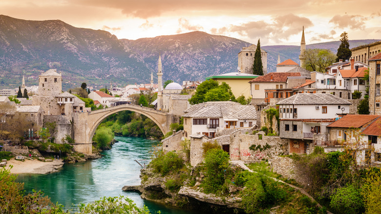 Historic stone bridge crossing a turquoise river in the Bosnian town of Mostar
