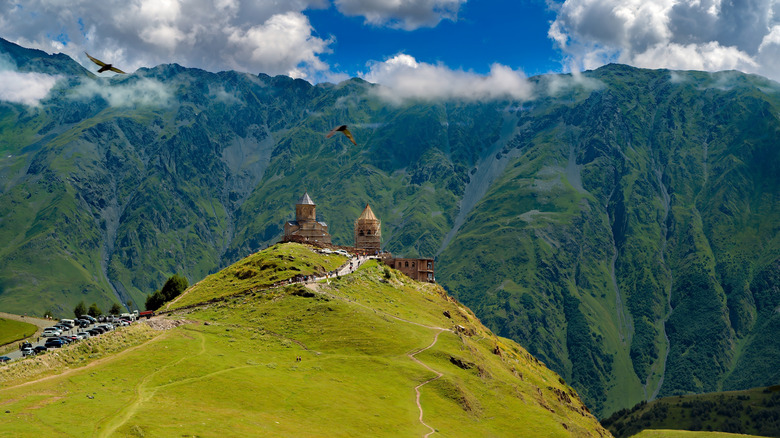 Ancient stone church high in the green mountains of Georgia