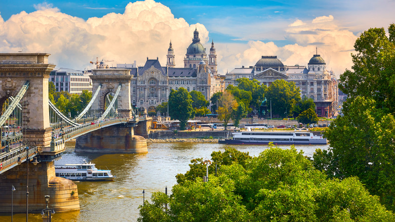 Budapest's train bridge crossing the Danube River with ornate buildings in the background