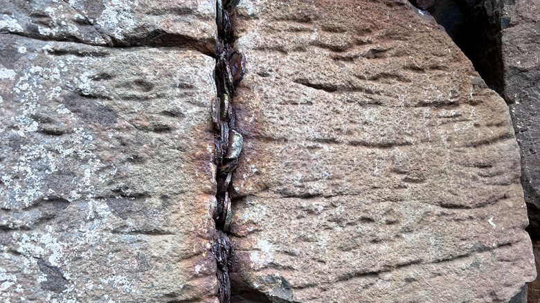 Coins stuck between rocks in the Giant's Causeway