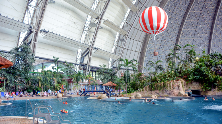 View of the pool and hot air balloon at the Tropical Islands indoor water park.