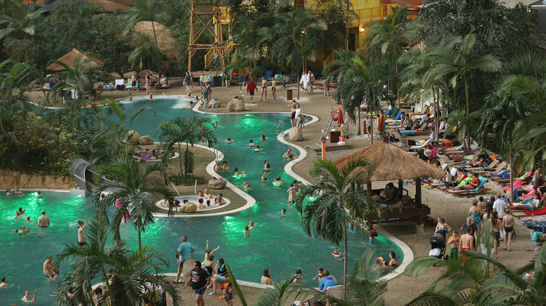 Visitors swim in the lagoon at the Tropical Islands indoor water park in Germany.
