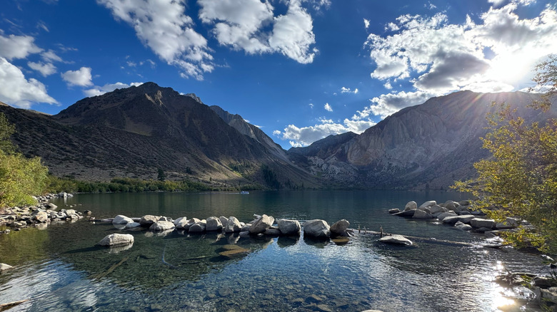 The sun shining over Convict Lake in California's Sierra Nevada