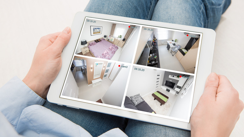 Someone watching different feeds from cameras in a house