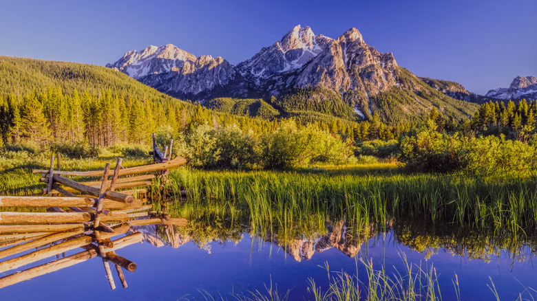 A crystal clear lake and blue sky in the Sawtooth National Forest in central Idaho