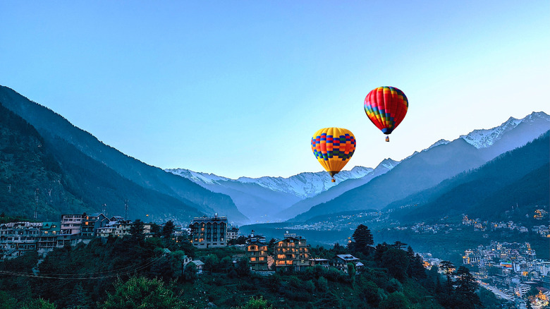 Air balloons floating over the Himalayas