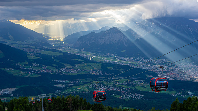 A cable car system called the Patscherkofelbahn with Innsbruck below