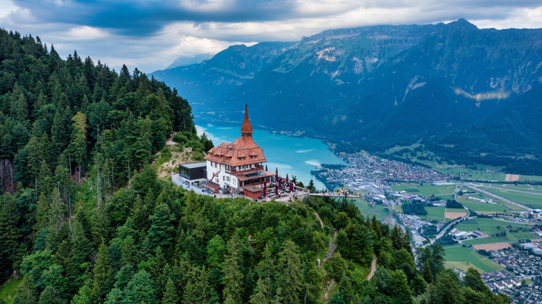 Chalet atop Harder Kulm surrounded by Swiss landscape