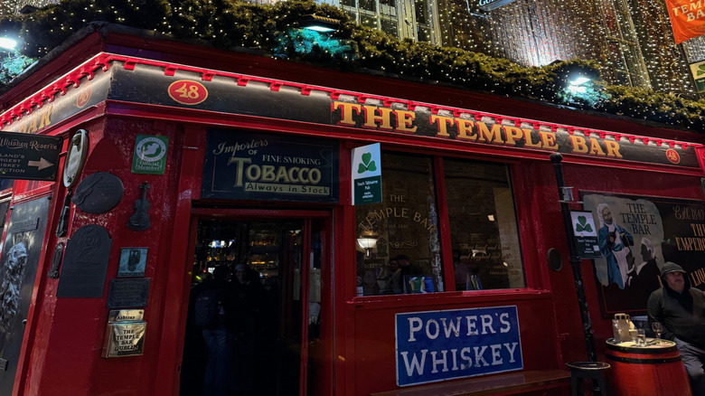 Close-up view of The Temple Bar Pub at night lit up with fairy lights
