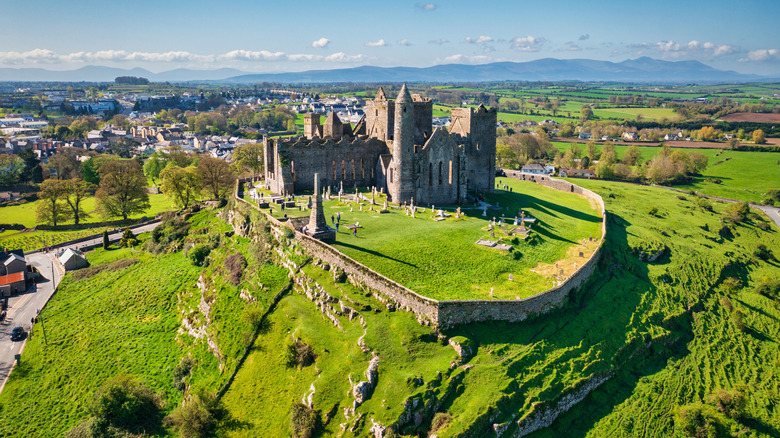 Aerial view of medieval buildings at the Rock of Cashel historic site on a sunny day in County Tipperary, Ireland