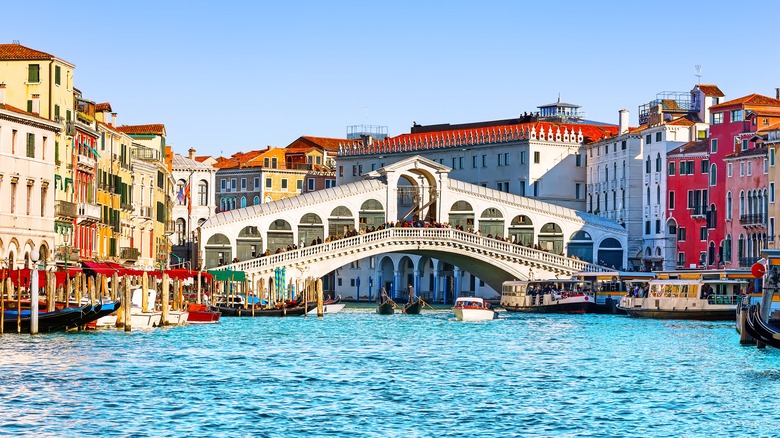 The Grand Canal and Rialto Bridge on a sunny day in Venice