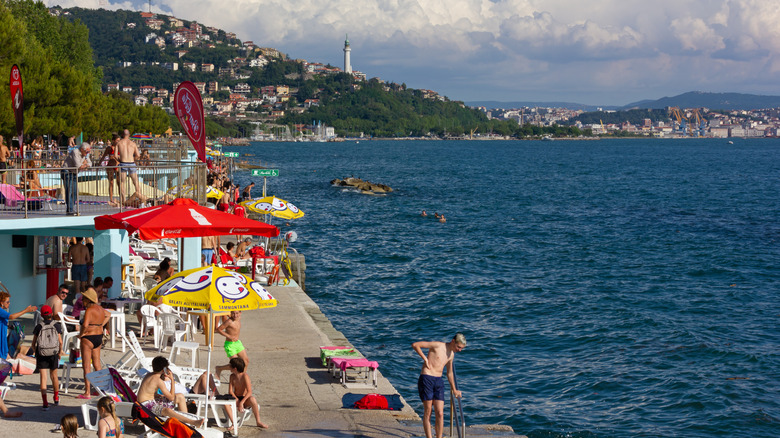 Barcola beachfront crowded with tourists by the water