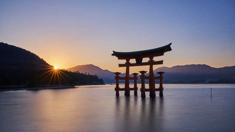 Floating torii gate in Miyajima at sunrise