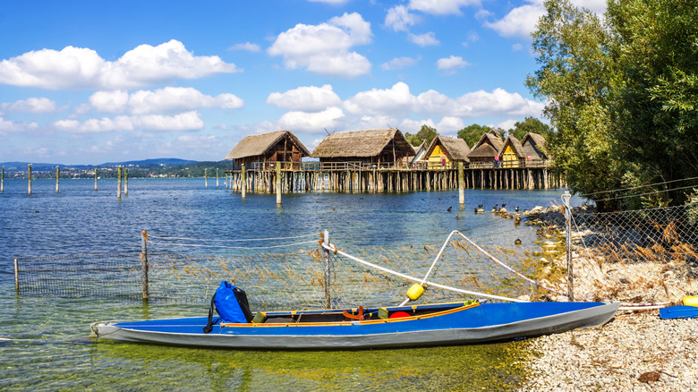 The German Stilt House Museum on Lake Constance with a kayak in the foreground