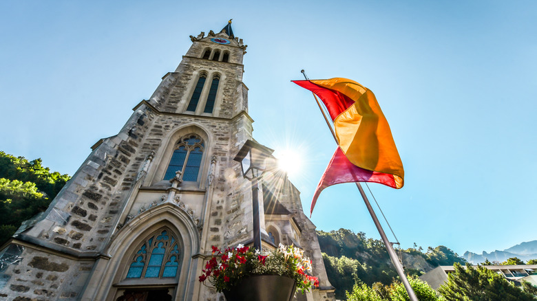 Low angle view of St. Florin Cathedral with flag on a sunny day
