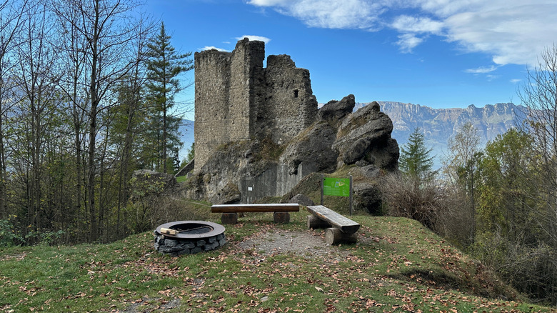 Castle ruins in the Liechtenstein mountains surrounded by fall foliage