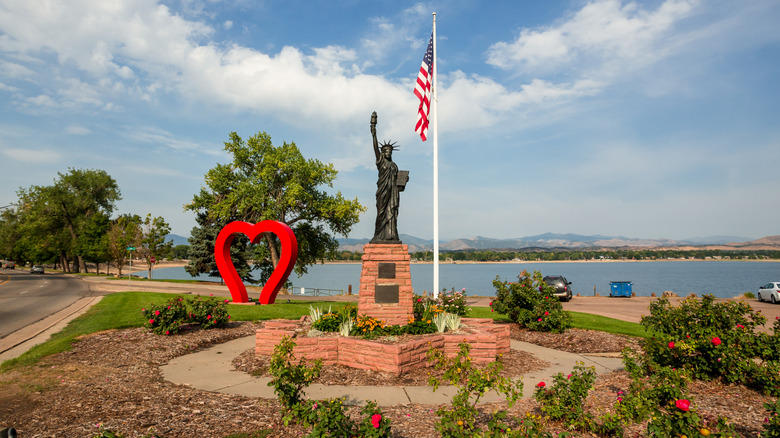 An American flagpole in a parkette by water