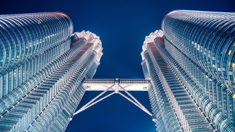 The Petronas Towers from ground level at twilight