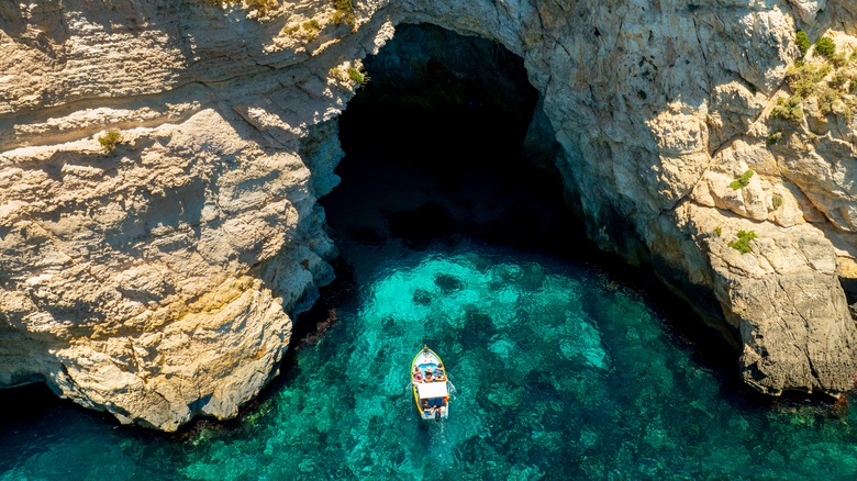 An aerial view of a boat near the Blue Grotto caves in Malta