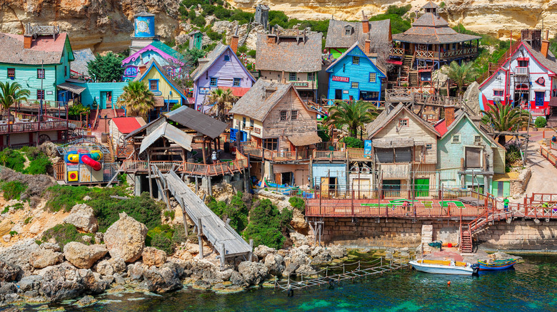 Colorful homes and trees at Popeye Village near Anchor Bay in Malta
