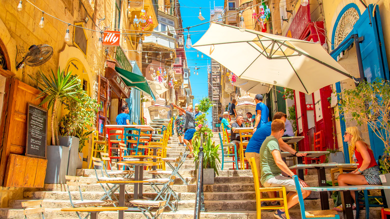 Outdoor restaurants on stepped passages in Valletta