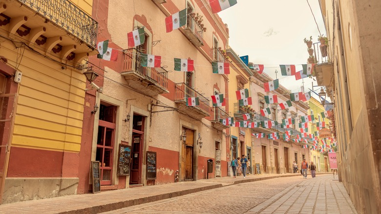 A street decorated with Mexican flags in Guanajuato