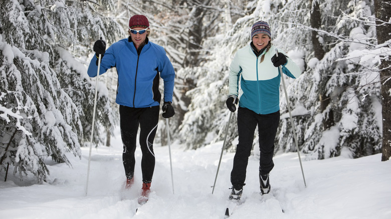 A couple cross-country skis on a trail in the Midwestern U.S.