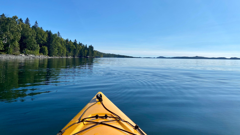 A kayak cuts through the calm water on Lake Superior