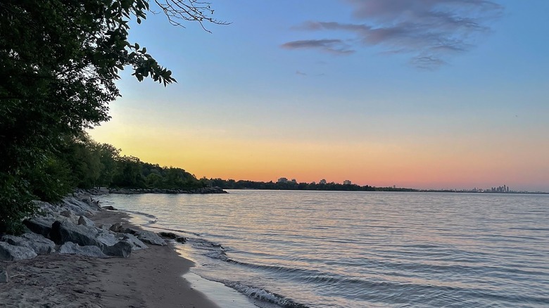 Water and shoreline at sunset in Jack Darling Memorial Park Beach Mississauga