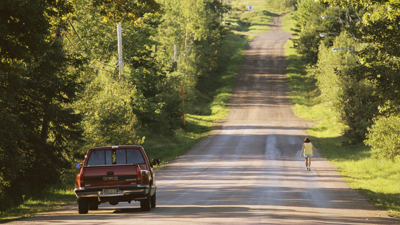 A truck and a pedestrian on Magnetic Hill