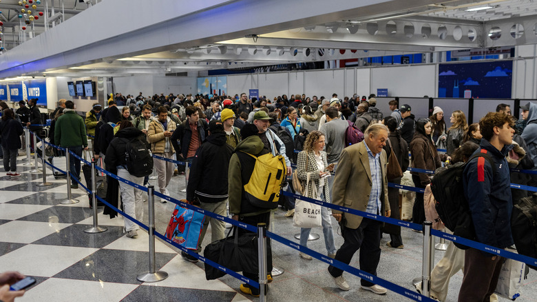 A long line of travelers waiting for a TSA security checkpoint in Terminal 1 at Chicago O'Hare International Airport