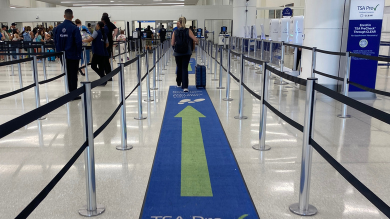A regular security line next to a TSA PreCheck line