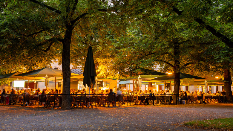 A busy beer garden in the early evening in Munich