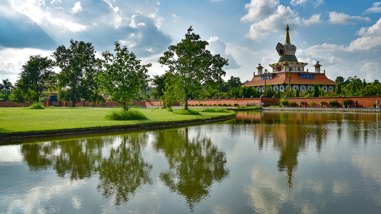 Reflection of a Buddhist temple on water in Lumbini, the birth place of Buddha.